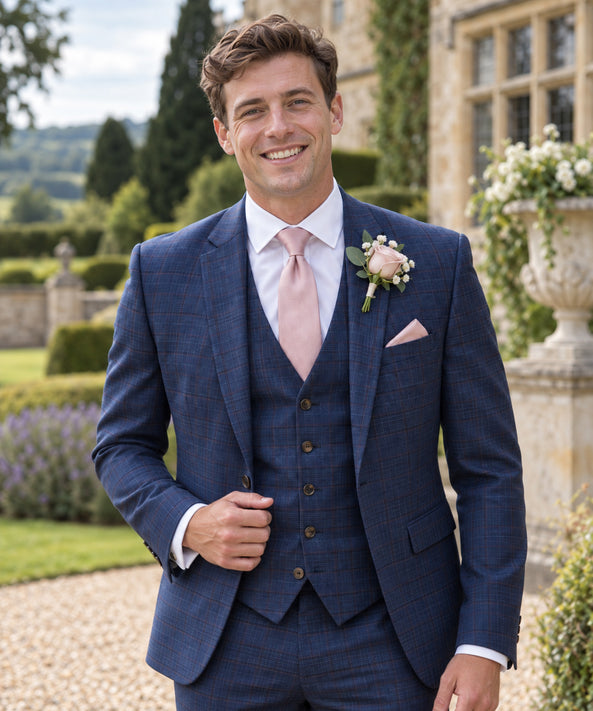 groom wearing navy check 3 piece suit to hire